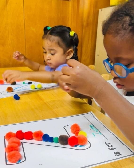 Children practicing early math skills at Sweet Angels Daycare
