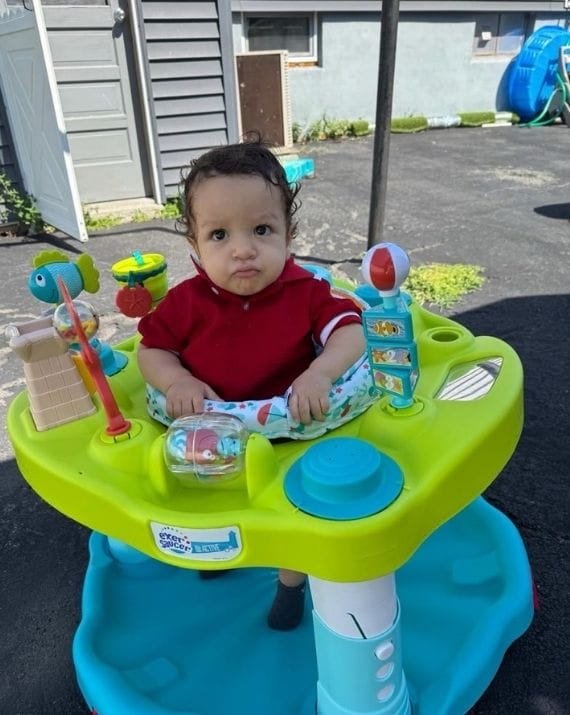 Infant enjoying outdoor play at Sweet Angels Daycare