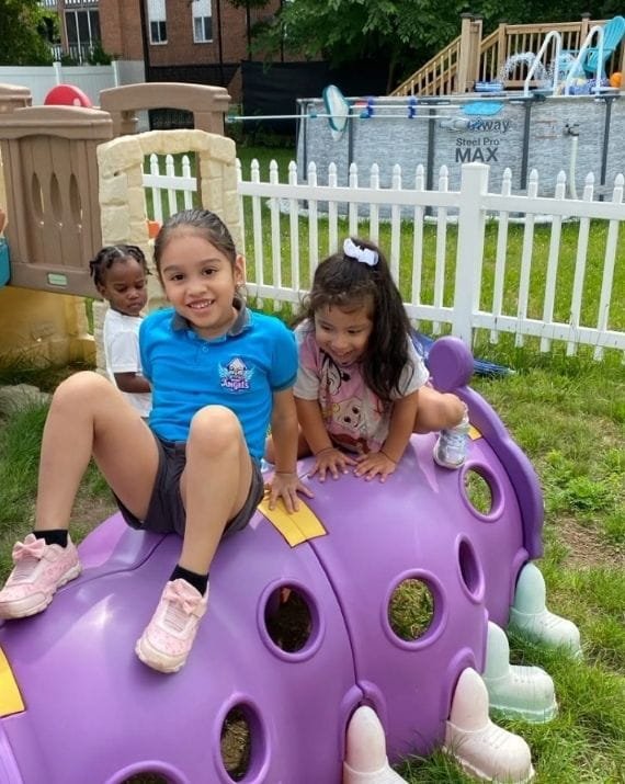 Children playing outdoors at Sweet Angels Daycare