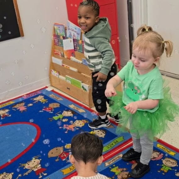 Children participating in a music and movement activity at Sweet Angels