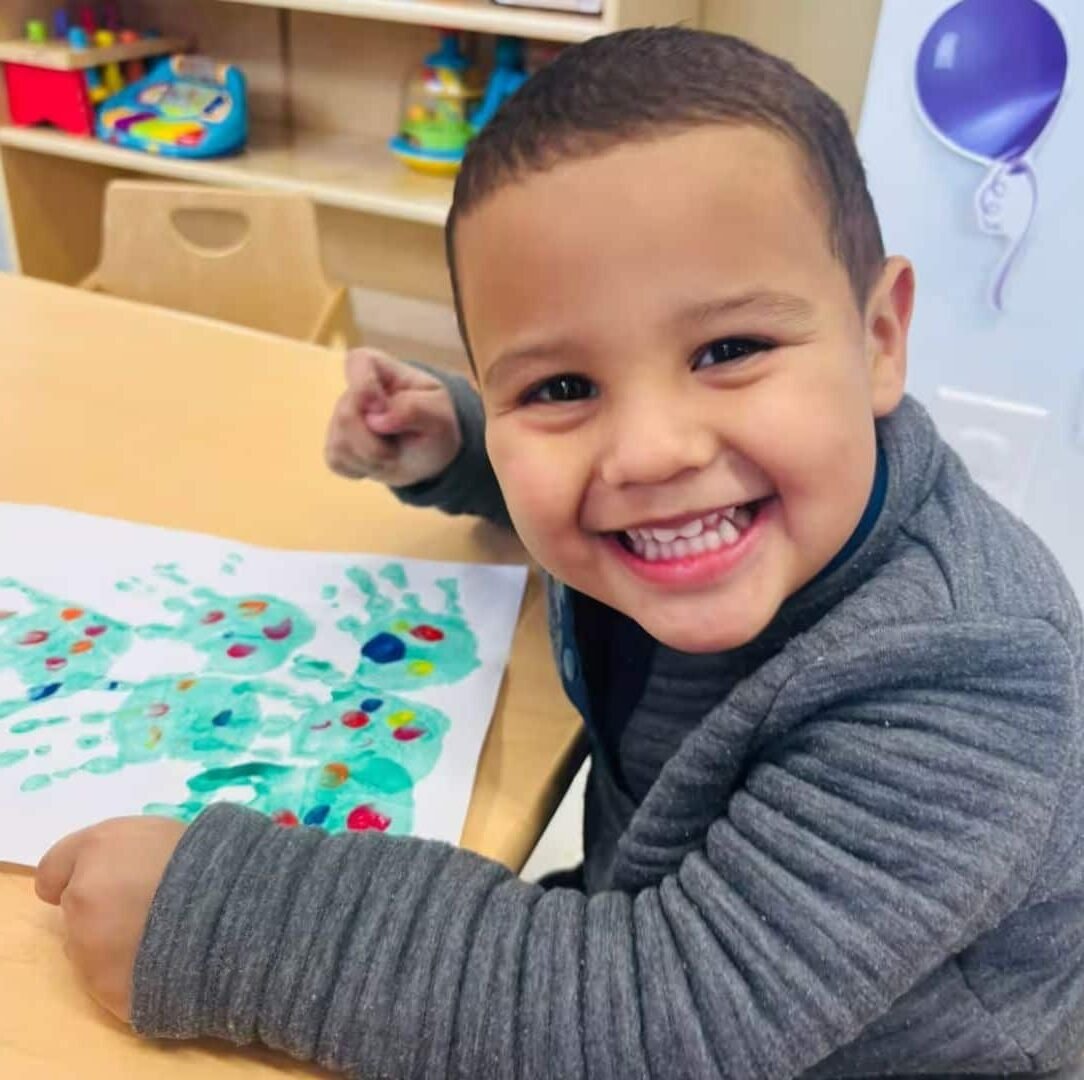 Smiling child at Sweet Angels Daycare in Everett, MA