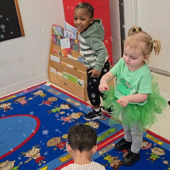 Children participating in music and movement activities at Sweet Angels Daycare & Preschool Center