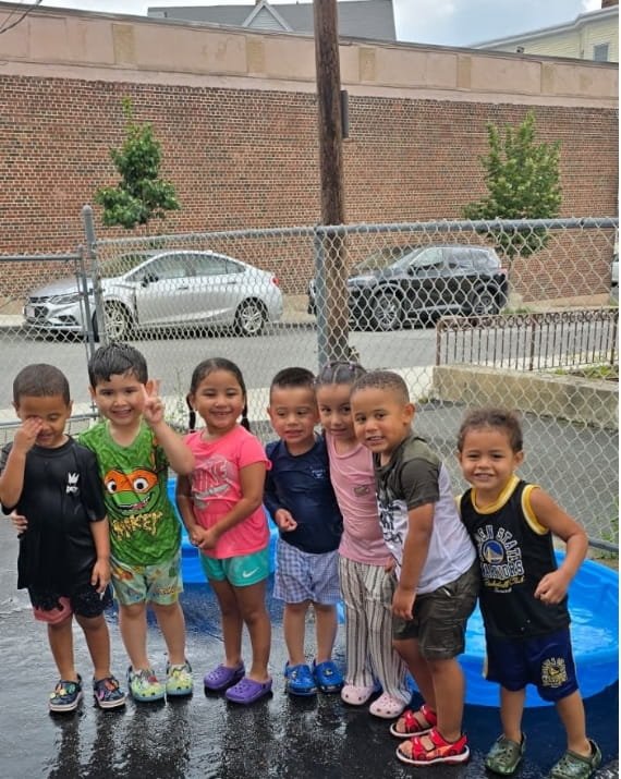 Children enjoying outdoor play at Sweet Angels Daycare in Everett, MA