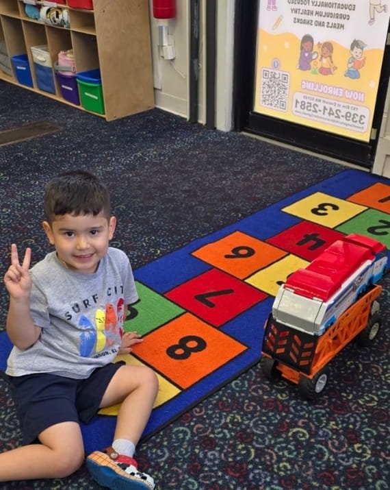 Child exploring numbers through play at Sweet Angels Daycare in Everett, MA