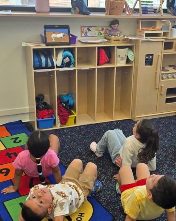 Children participating in a group activity at Sweet Angels Daycare in Everett, MA